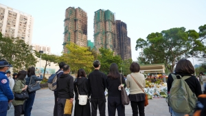Five SFU student representatives carried the flowers collected in the special Mass to the memorial area. They conducted a floral tribute to express condolences to fire victims and extend blessings to those affected.