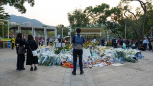 Five SFU student representatives carried the flowers collected in the special Mass to the memorial area. They conducted a floral tribute to express condolences to fire victims and extend blessings to those affected.
