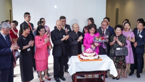 Bishop Most Rev Michael Yeung, Bishop Emeritus Cardinal Jong Tong (5th and 4th from left) and others celebrate Mrs Rita Tong Liu’s (centre, in ruby) 70th birthday.